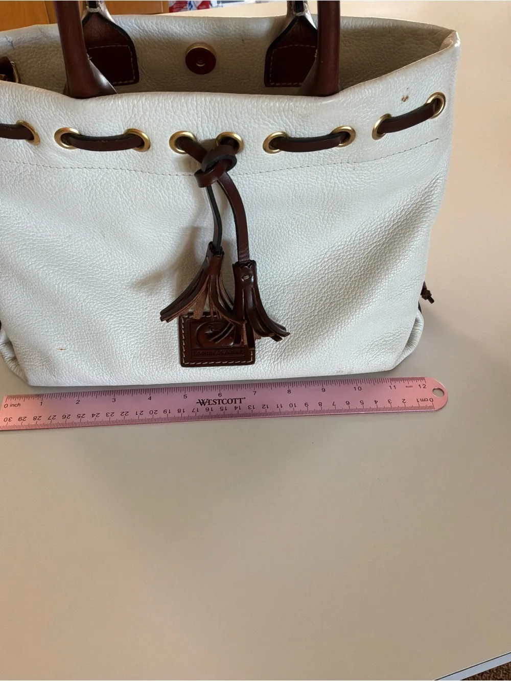 Dooney & Bourke White Pebbled Leather Satchel with Brown Trim and Tassel